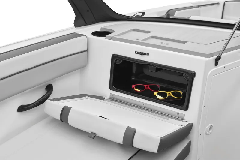 Slide: The Image of Yamaha AR220 2024 boat with storage compartment and sunglasses. - 32