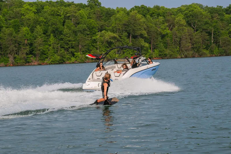 Slide: The Image of Yamaha AR220 2024 towing wakeboarder on a lake. - 5