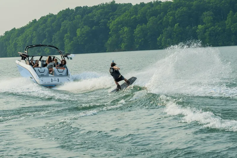 Slide: The Image of Yamaha AR220 2024 towing wakeboarder on a lake. - 9