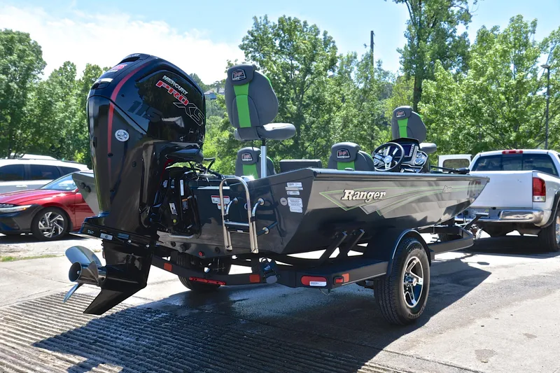 Slide: The Image of 2025 Ranger RT188 boat with Mercury Pro XS engine, parked outdoors on a sunny day. - 14