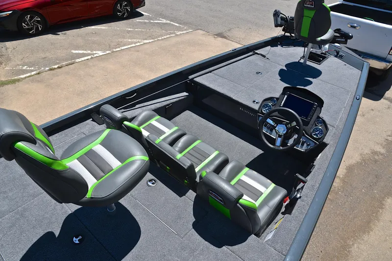 Slide: The Image of 2025 Ranger RT188 boat interior with green-accented seats and modern dashboard. - 21