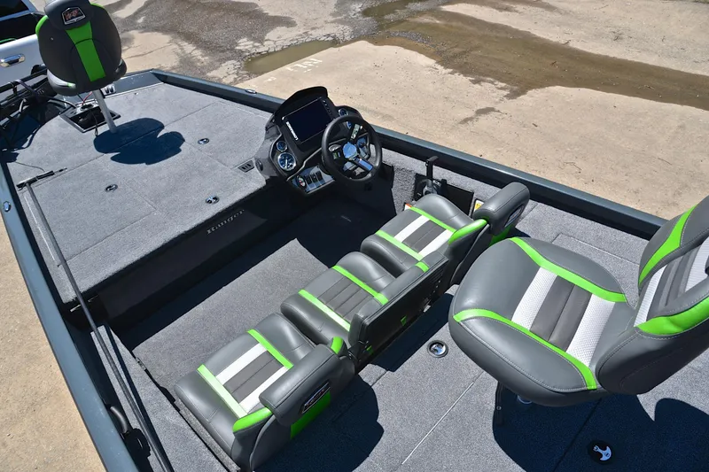Slide: The Image of 2025 Ranger RT188 boat interior with gray and green seating, steering console, and spacious deck. - 22