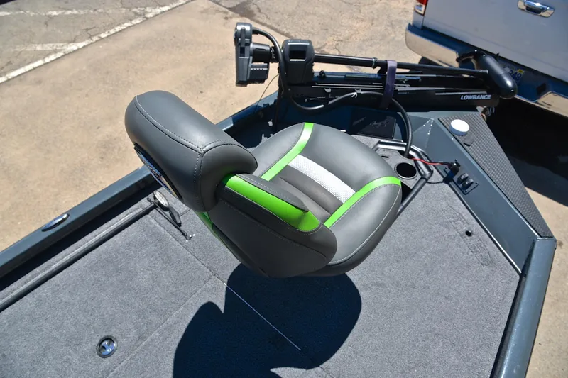 Slide: The Image of 2025 Ranger RT188 boat seat with green accents and fishing equipment on deck. - 26