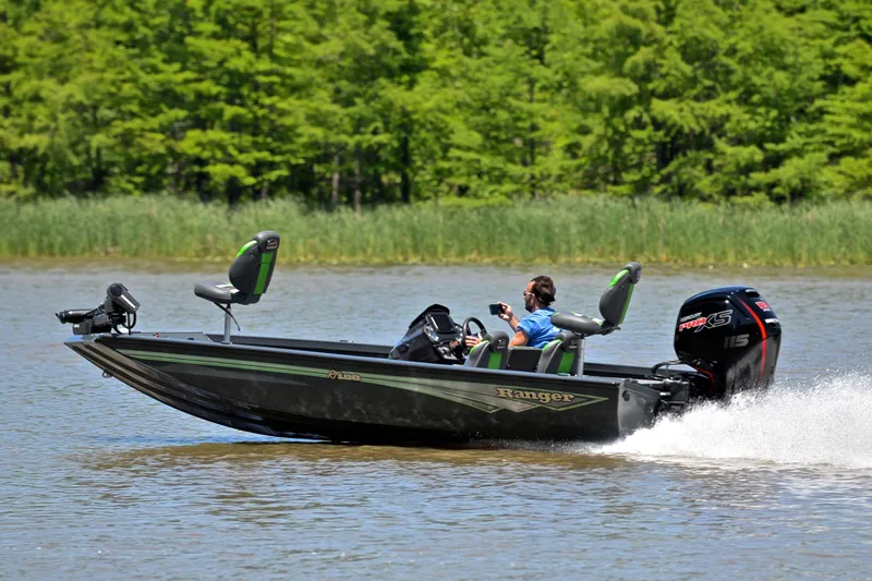 Slide: The Image of 2025 Ranger RT188 boat cruising on a lake with lush green trees in the background. - 4