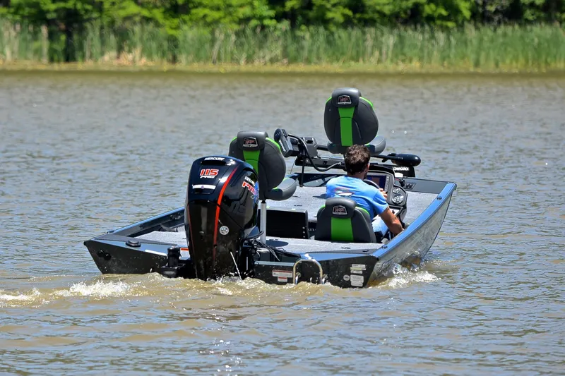 Slide: The Image of 2025 Ranger RT188 boat cruising on a lake with a Mercury 115 engine. - 8