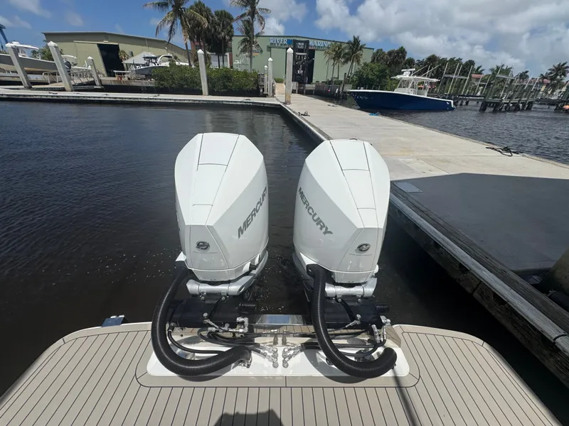 Slide: The Image of Scout 330 LXF 2021 with Mercury outboard engines at the dock. - 35