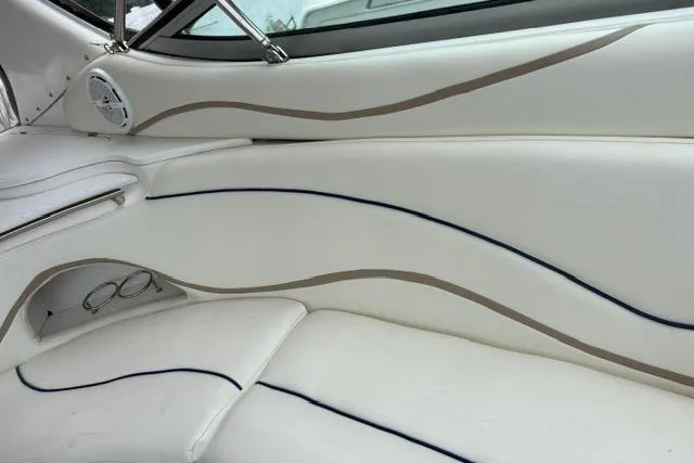 Slide: The Image of Interior of 2001 Wellcraft 3300 Martinique boat with white seating and elegant design. - 14