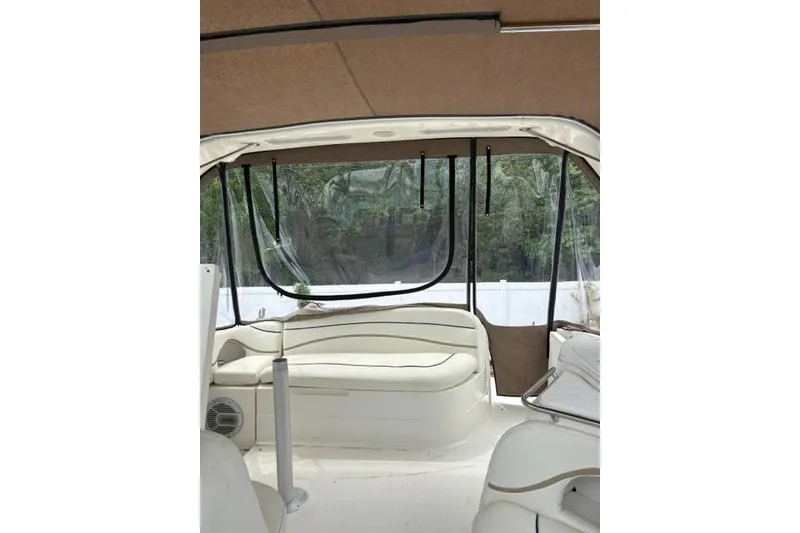 Slide: The Image of Interior view of 2001 Wellcraft 3300 Martinique boat with beige seating and canopy. - 15