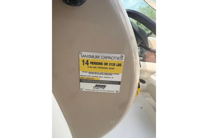 Slide: The Image of 2006 Chaparral Sunesta 236 capacity label, maximum 14 persons or 2135 lbs. - 15