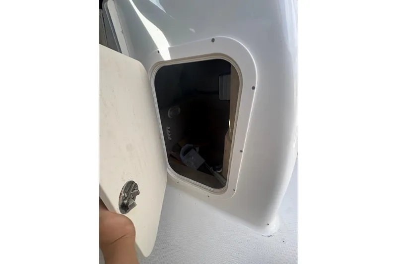 Slide: The Image of Open storage compartment on 2006 Chaparral Sunesta 236 boat. - 17