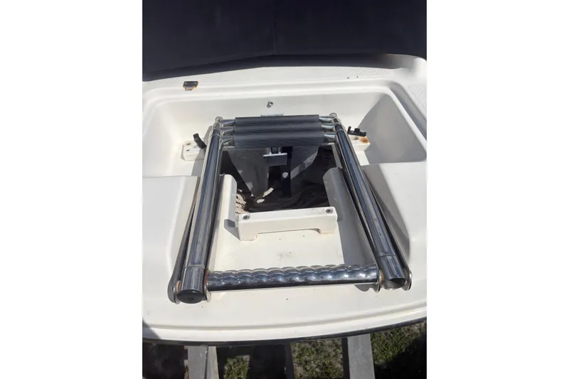 Slide: The Image of 2006 Chaparral Sunesta 236 boat ladder in storage compartment. - 20
