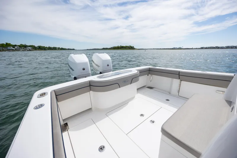 Slide: The Image of 2022 Valhalla Boatworks V-33 with twin Mercury engines on calm water. - 12