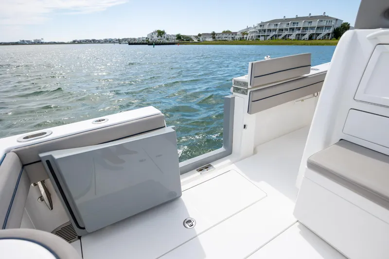 Slide: The Image of 2022 Valhalla Boatworks V-33 interior with open deck, overlooking serene waterfront view. - 16