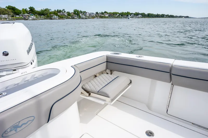 Slide: The Image of 2022 Valhalla Boatworks V-33 with Mercury engine, featuring sleek seating and ocean view. - 17