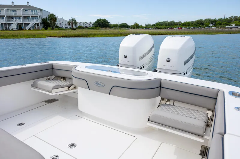 Slide: The Image of 2022 Valhalla Boatworks V-33 with twin Mercury engines, featuring spacious seating and sleek design. - 19