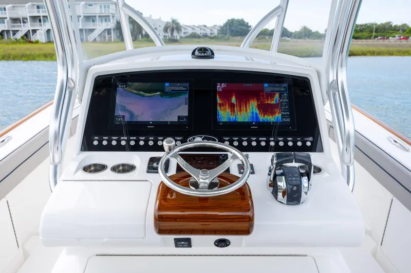 Slide: The Image of 2022 Valhalla Boatworks V-33 helm with advanced navigation displays and controls. - 22