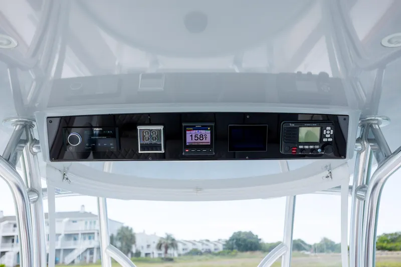 Slide: The Image of 2022 Valhalla Boatworks V-33 dashboard with modern navigation and control instruments. - 23