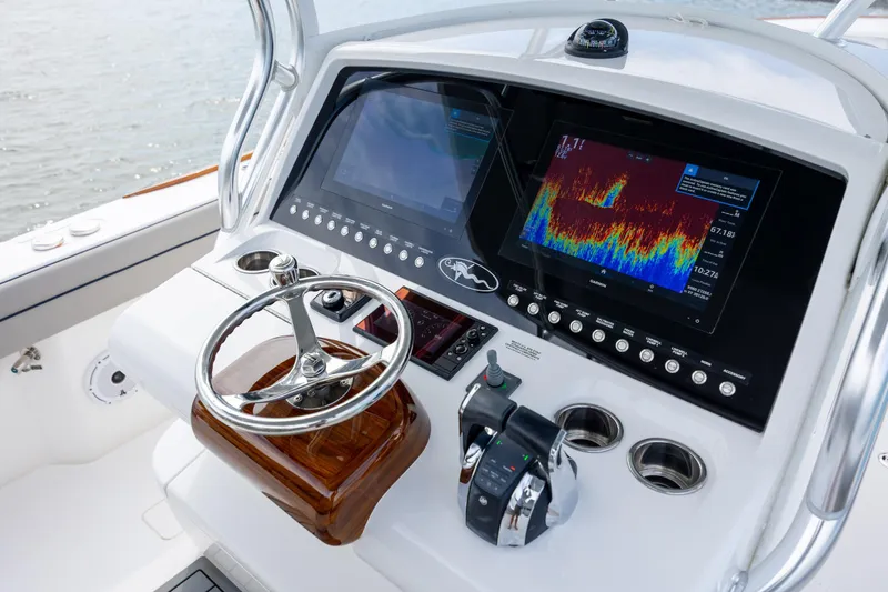 Slide: The Image of 2022 Valhalla Boatworks V-33 helm with advanced navigation displays and controls. - 25