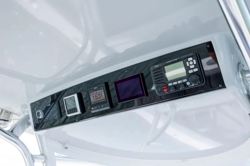 Slide: The Image of 2022 Valhalla Boatworks V-33 dashboard with modern navigation and communication equipment. - 26