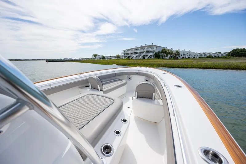 Slide: The Image of 2022 Valhalla Boatworks V-33 on water near luxury waterfront homes. - 29