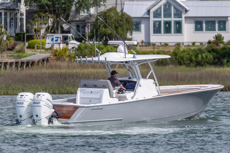 Slide: The Image of 2022 Valhalla Boatworks V-33 cruising on water with dual Mercury engines. - 3
