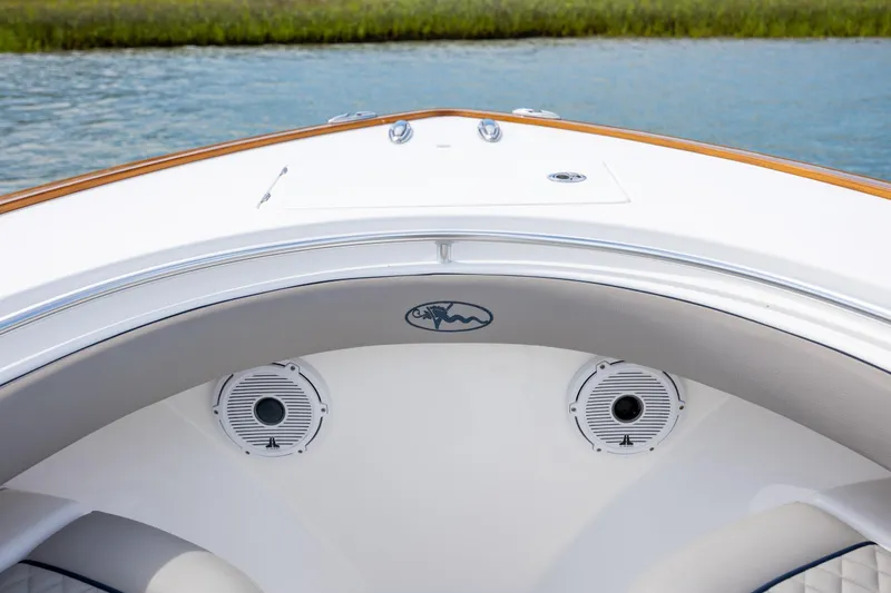 Slide: The Image of 2022 Valhalla Boatworks V-33 bow with speakers, on calm water. - 32