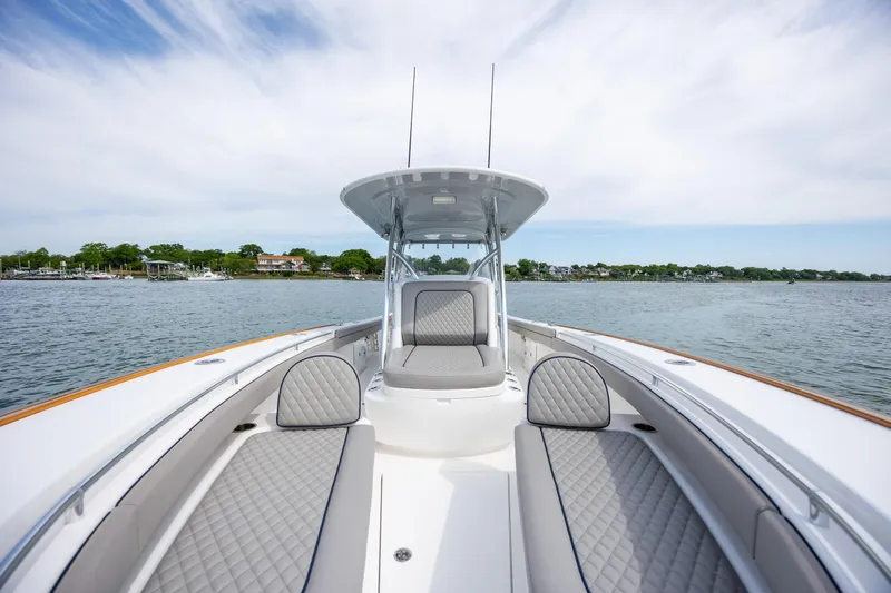 Slide: The Image of 2022 Valhalla Boatworks V-33 on calm water, showcasing sleek design and luxurious seating. - 33