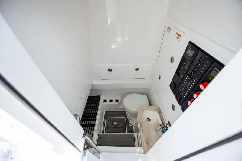 Slide: The Image of 2022 Valhalla Boatworks V-33 interior with toilet, control panel, and sink. - 36