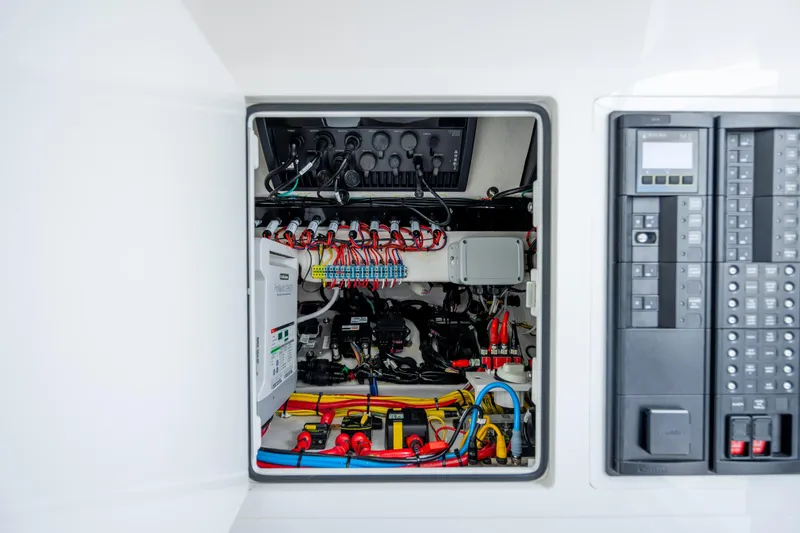 Slide: The Image of Electrical panel of 2022 Valhalla Boatworks V-33, showcasing wiring and control systems. - 39