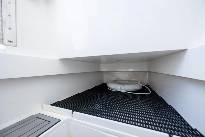 Slide: The Image of 2022 Valhalla Boatworks V-33 interior storage compartment with safety equipment. - 40