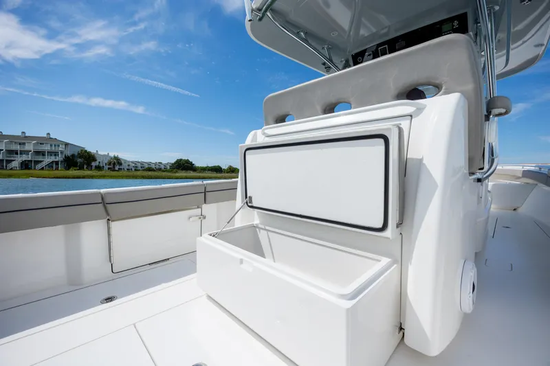 Slide: The Image of 2022 Valhalla Boatworks V-33 interior with open storage compartment, showcasing sleek design. - 45