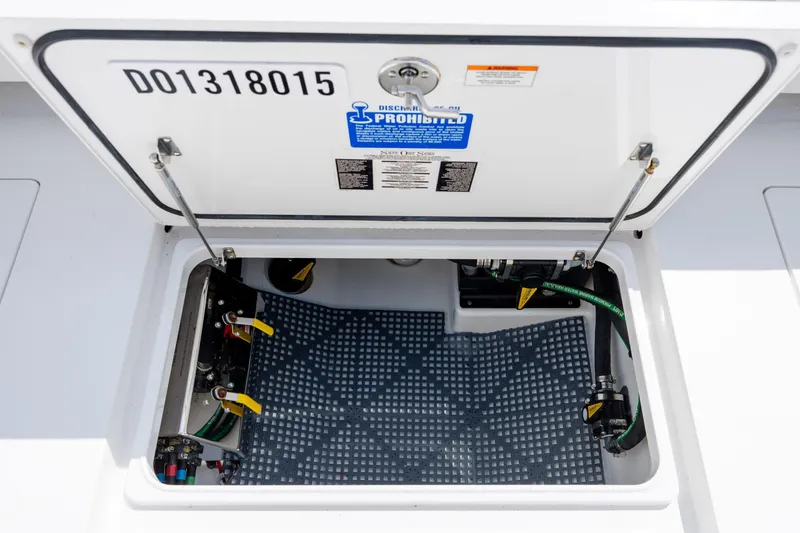 Slide: The Image of Open hatch of 2022 Valhalla Boatworks V-33, showcasing internal components and wiring. - 48