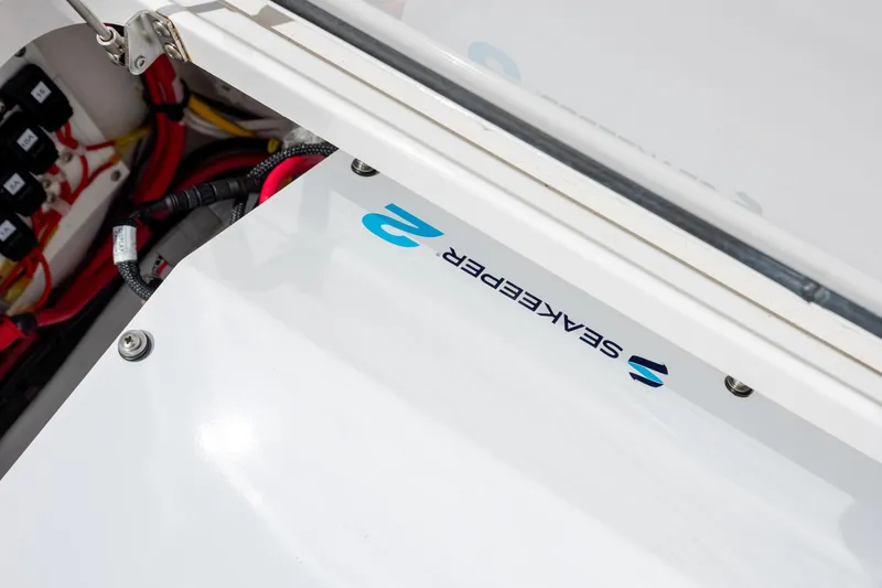 Slide: The Image of 2022 Valhalla Boatworks V-33 electrical compartment with Seakeeper branding and wiring details. - 50