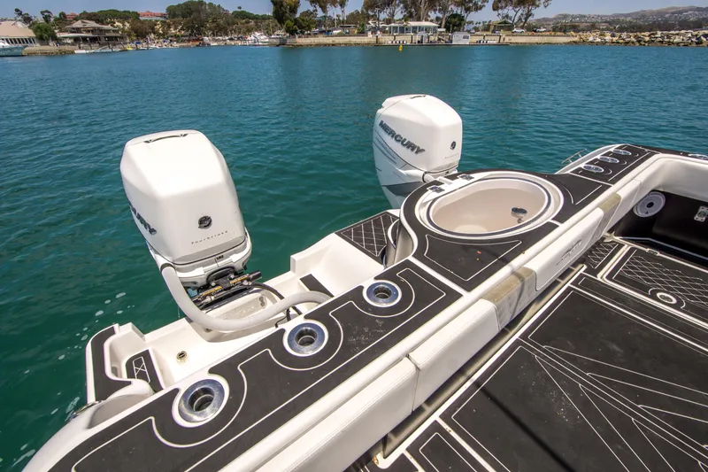 Slide: The Image of Invincible 35 Catamaran 2021 with Mercury engines on calm water. - 18