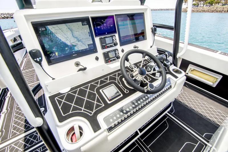 Slide: The Image of Invincible 35 Catamaran 2021 helm with advanced navigation systems. - 20