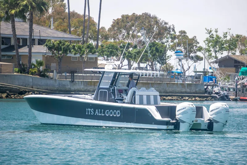 Slide: The Image of Invincible 35 Catamaran 2021 on water, featuring "It's All Good" lettering. - 8