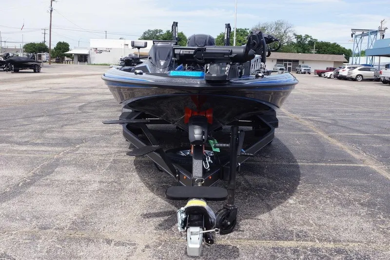 Slide: The Image of 2026 Skeeter ZXE21 boat on trailer in parking lot, front view. - 10