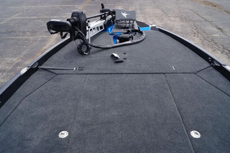 Slide: The Image of 2026 Skeeter ZXE21 boat deck with trolling motor and control panel. - 19