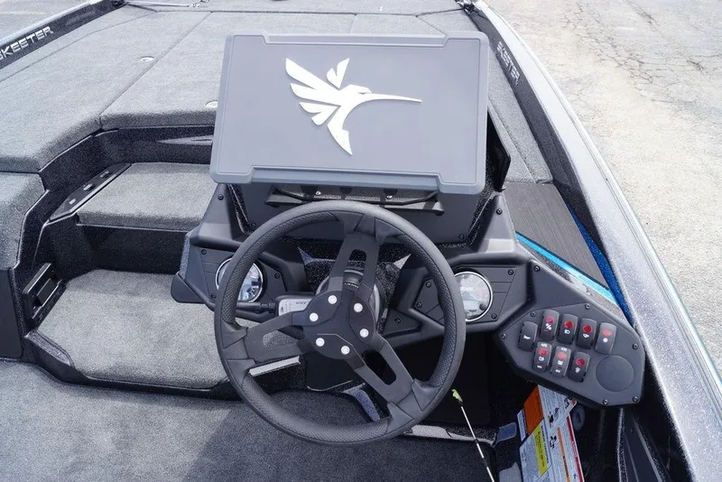Slide: The Image of Steering console of 2026 Skeeter ZXE21 boat with modern controls and logo. - 4