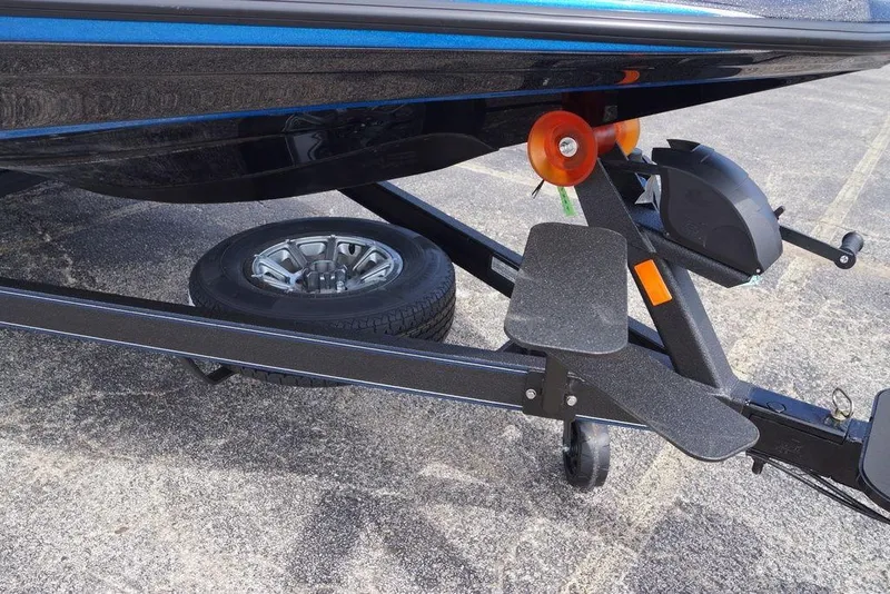 Slide: The Image of Trailer of 2026 Skeeter ZXE21 boat with spare tire and winch system. - 5