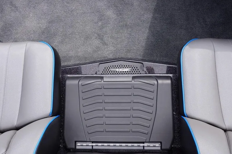 Slide: The Image of 2026 Skeeter ZXE21 boat interior with gray seats and central storage compartment. - 6
