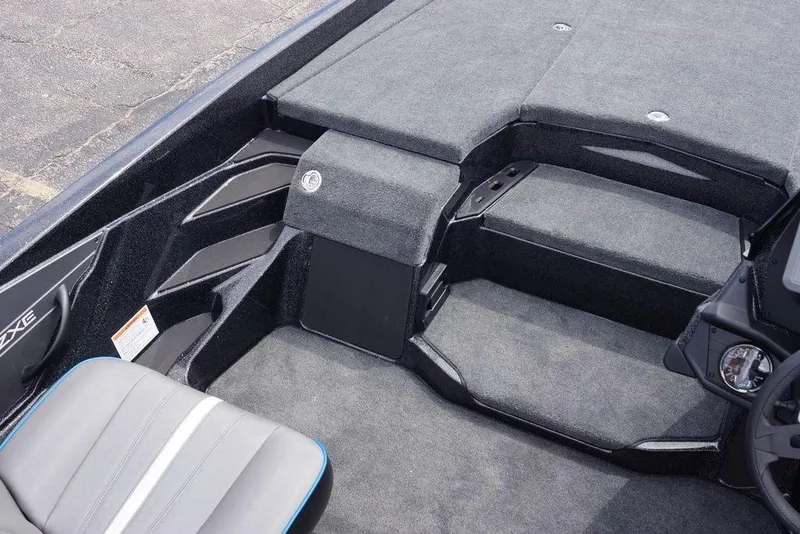 Slide: The Image of Interior of 2026 Skeeter ZXE21 boat, featuring sleek seating and carpeted flooring. - 7