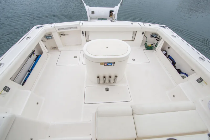 Slide: The Image of Spacious deck of 2002 Tiara Yachts 4100 Open, featuring storage and seating. - 18