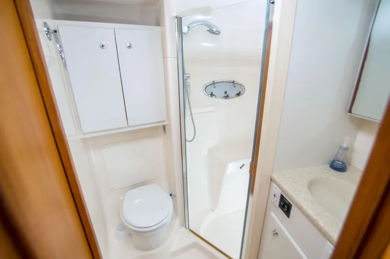 Slide: The Image of Bathroom interior of 2002 Tiara Yachts 4100 Open with shower and toilet. - 27