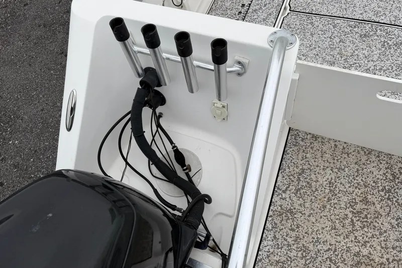 Slide: The Image of 2004 Pro Sports 2660 WA ProKat boat with rod holders and engine wiring. - 10