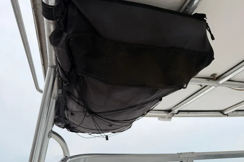Slide: The Image of Black storage bag on 2004 Pro Sports 2660 WA ProKat boat canopy. - 13