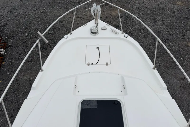 Slide: The Image of 2004 Pro Sports 2660 WA ProKat boat deck with railing and hatch. - 14