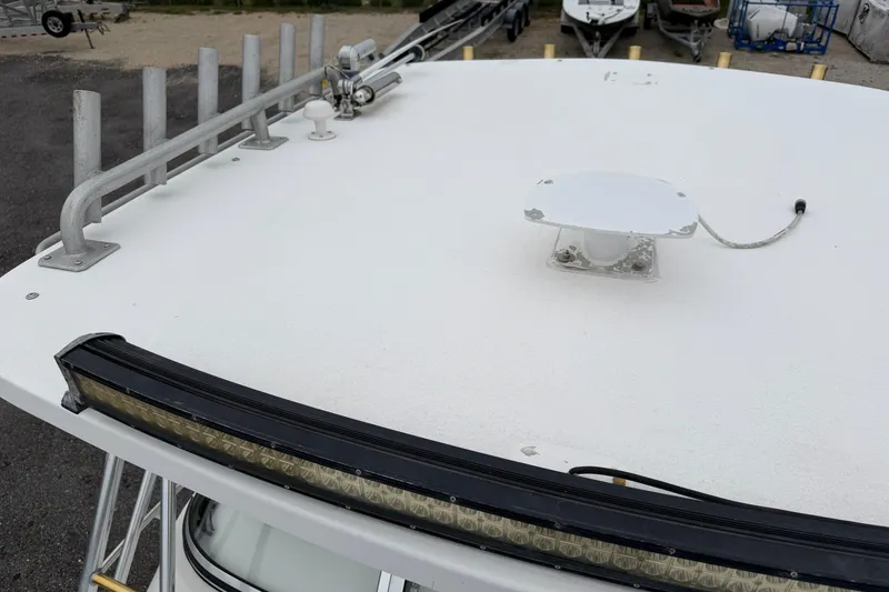 Slide: The Image of 2004 Pro Sports 2660 WA ProKat boat roof with rod holders and light bar. - 17