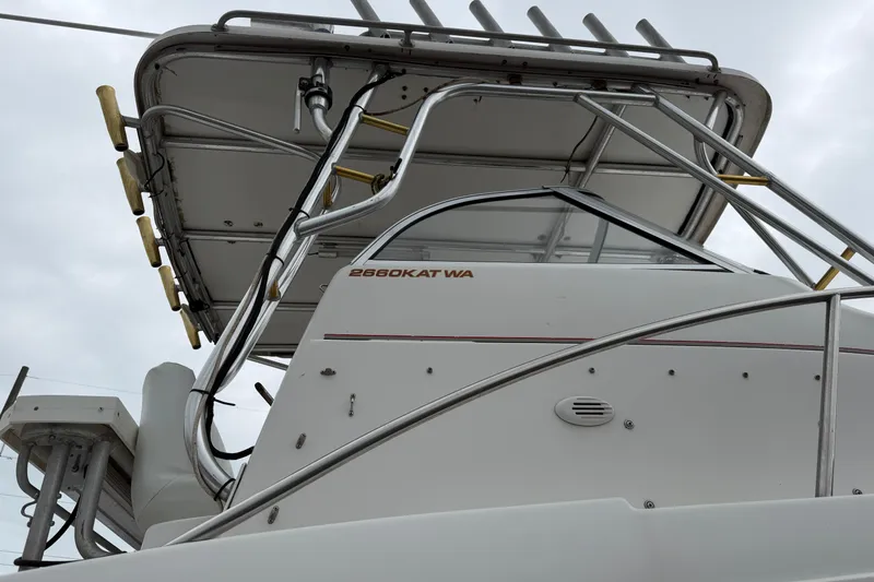 Slide: The Image of 2004 Pro Sports 2660 WA ProKat boat, featuring sleek design and sturdy structure. - 23