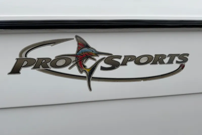 Slide: The Image of Pro Sports 2660 WA ProKat 2004 logo on boat exterior. - 24